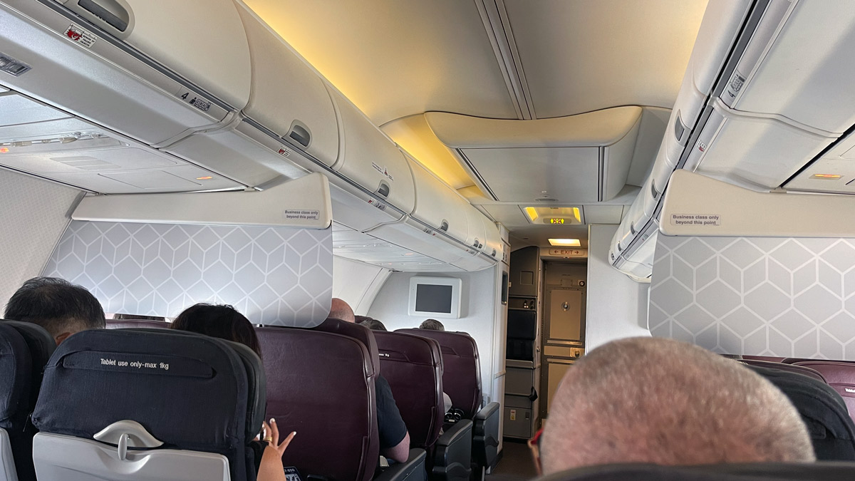 a group of people sitting in an airplane