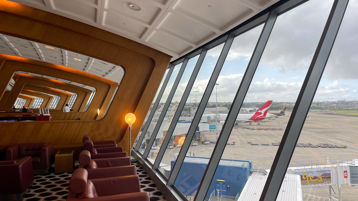 a room with leather chairs and a window