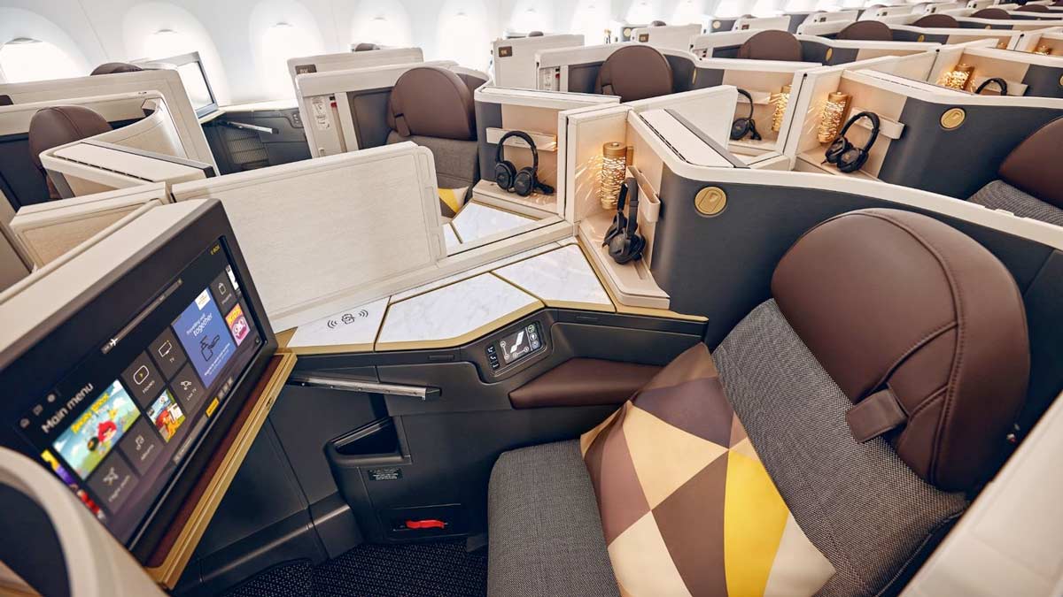 a seat with a computer and headphones on it