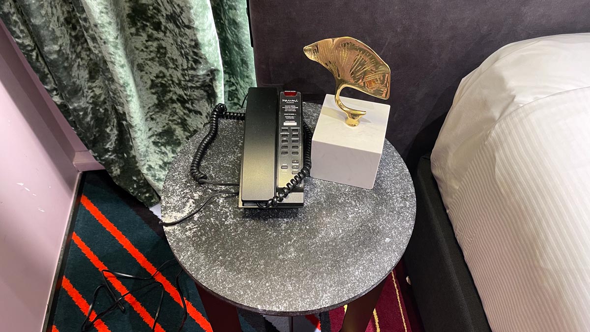 a telephone and a trophy on a table