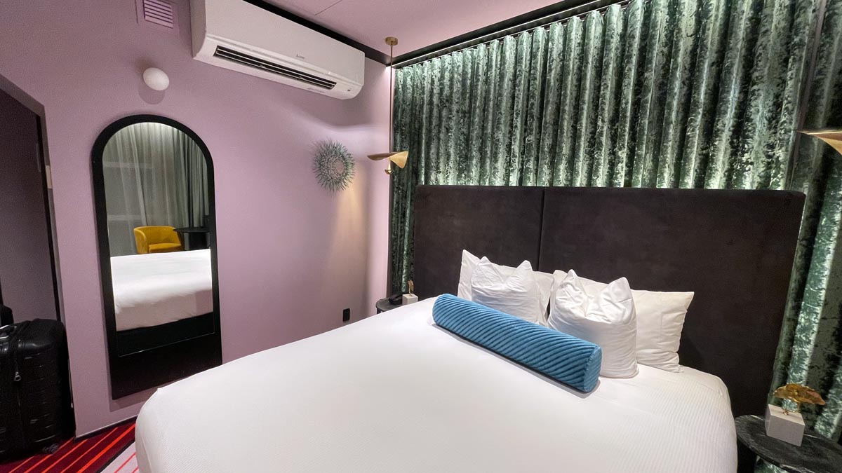 a bed with pillows and a pillow on it