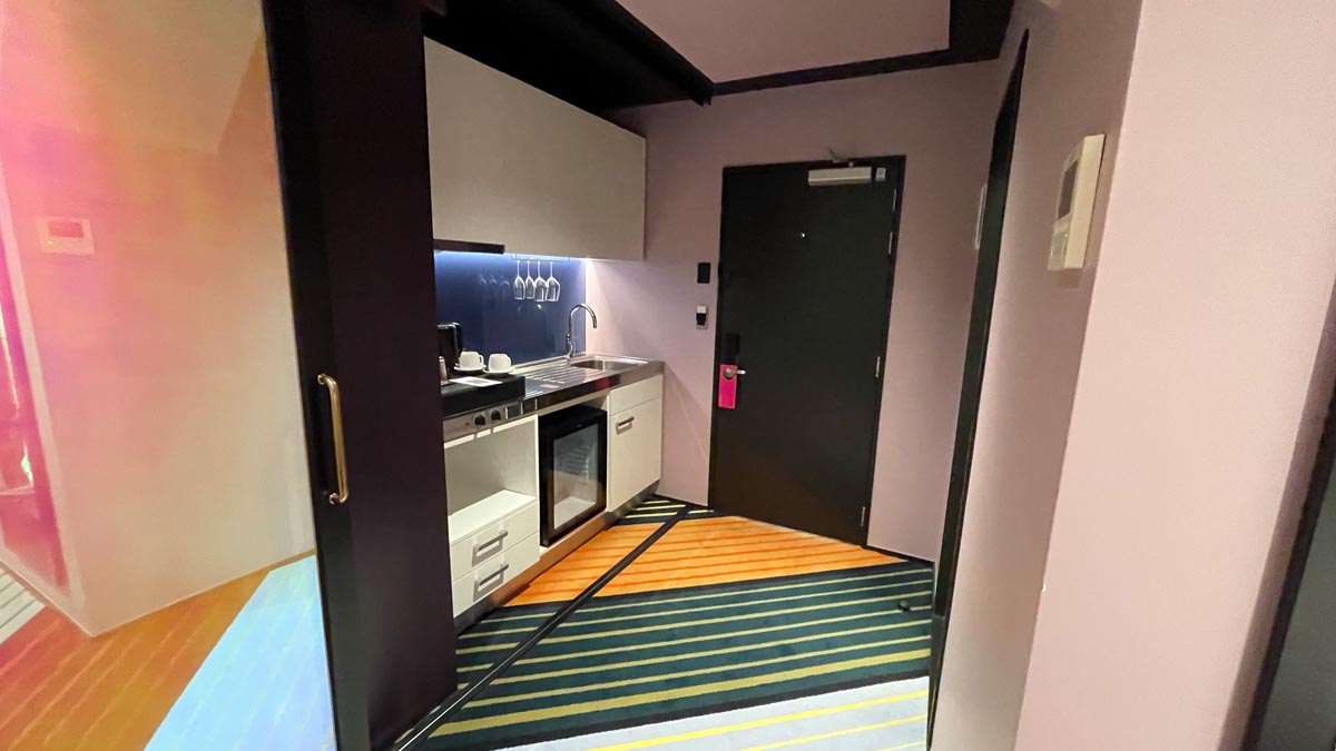 a room with a door and a sink