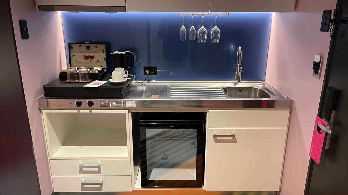 a kitchen with a sink and a microwave
