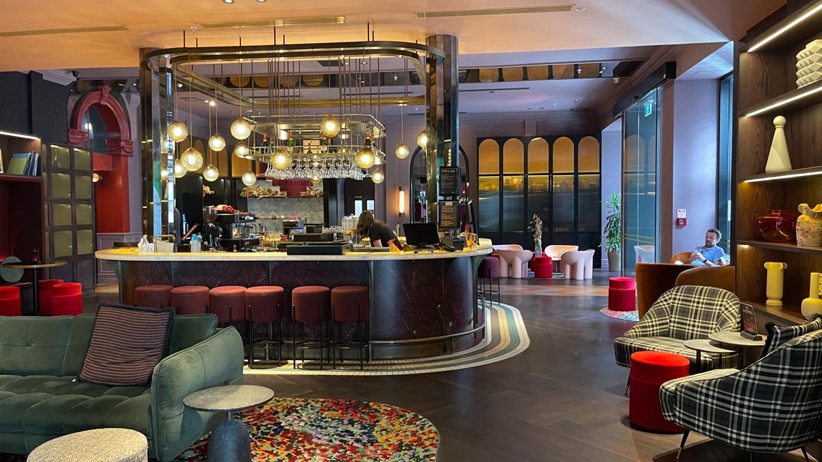 a room with a bar and chairs