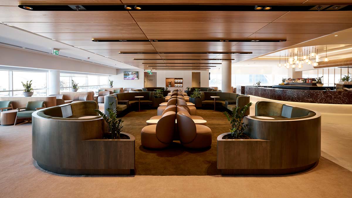 a room with a large area with chairs and tables