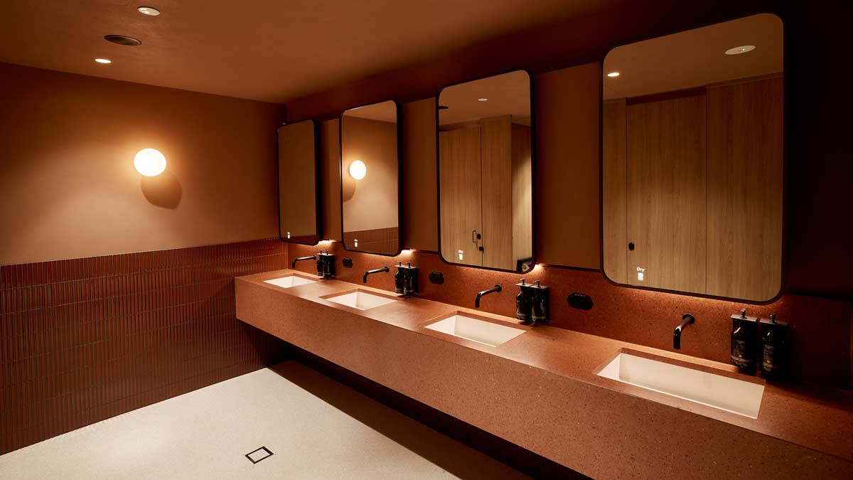 a bathroom with sinks and mirrors