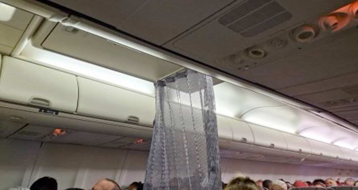 VIRGIN AUSTRALIA: Weird Business Class shower curtain divider reported.