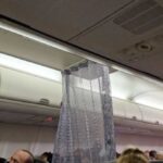 VIRGIN AUSTRALIA: Weird Business Class shower curtain divider reported.