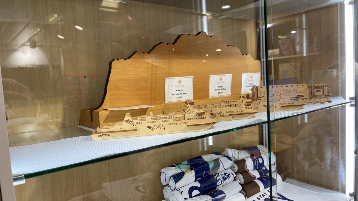 a display case with a wooden ship model