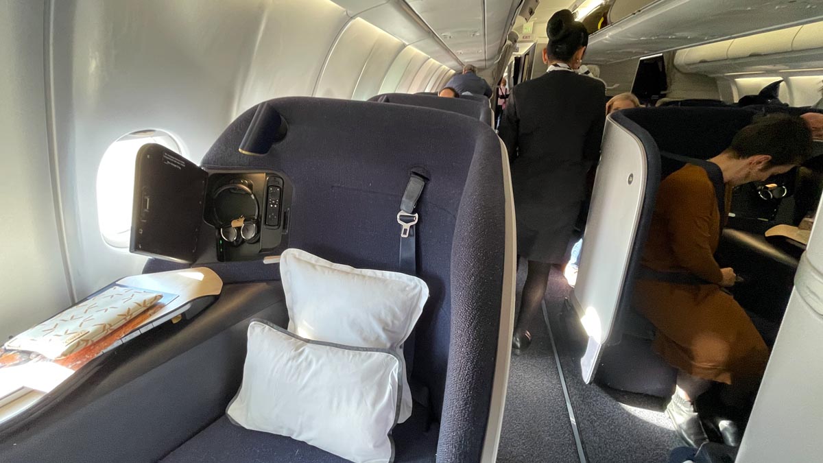 a group of people walking on an airplane