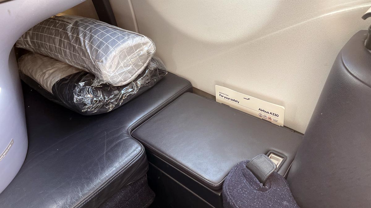 a seat with a pillow in it