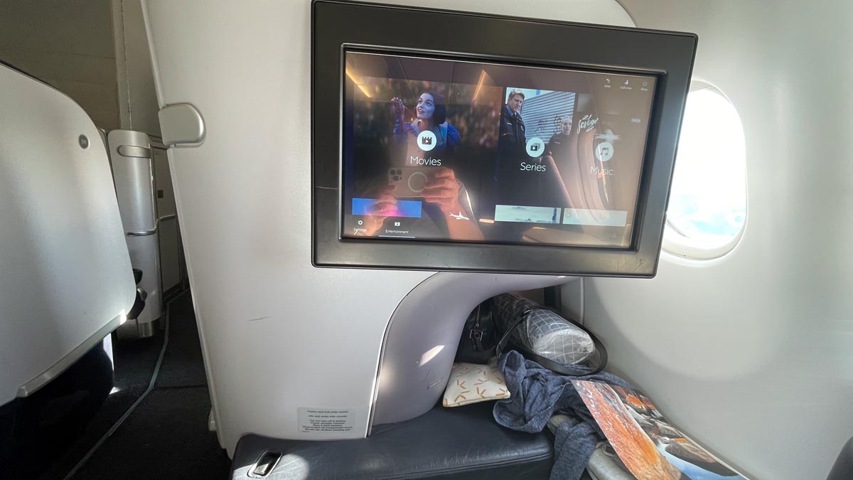 a screen on the seat of an airplane