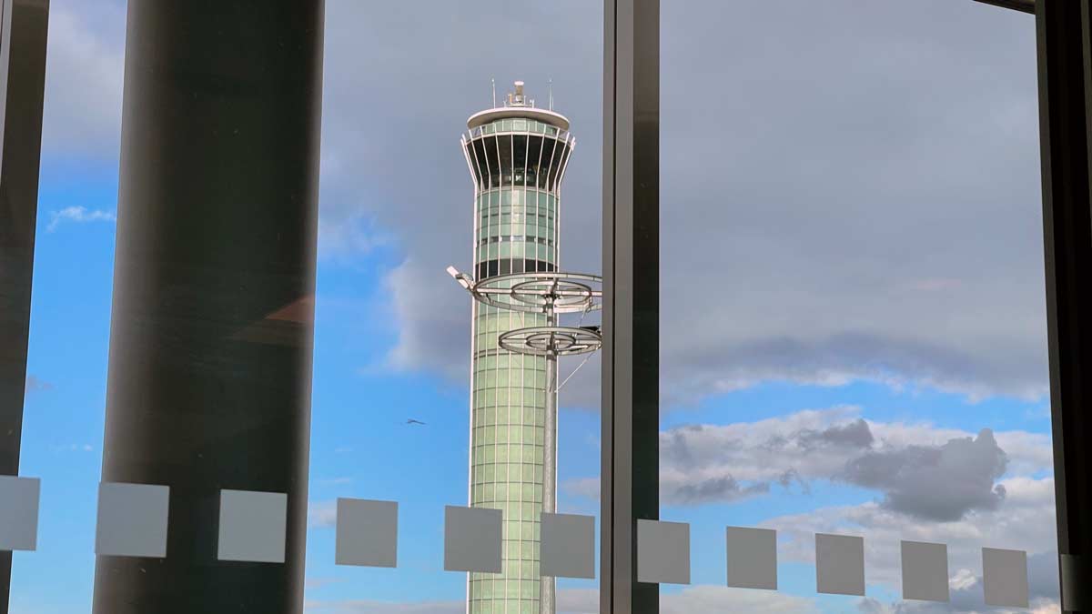 a tall tower seen through a window