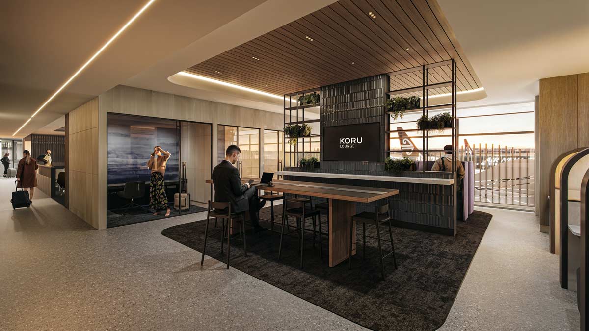 a man sitting at a desk in a hotel lobby