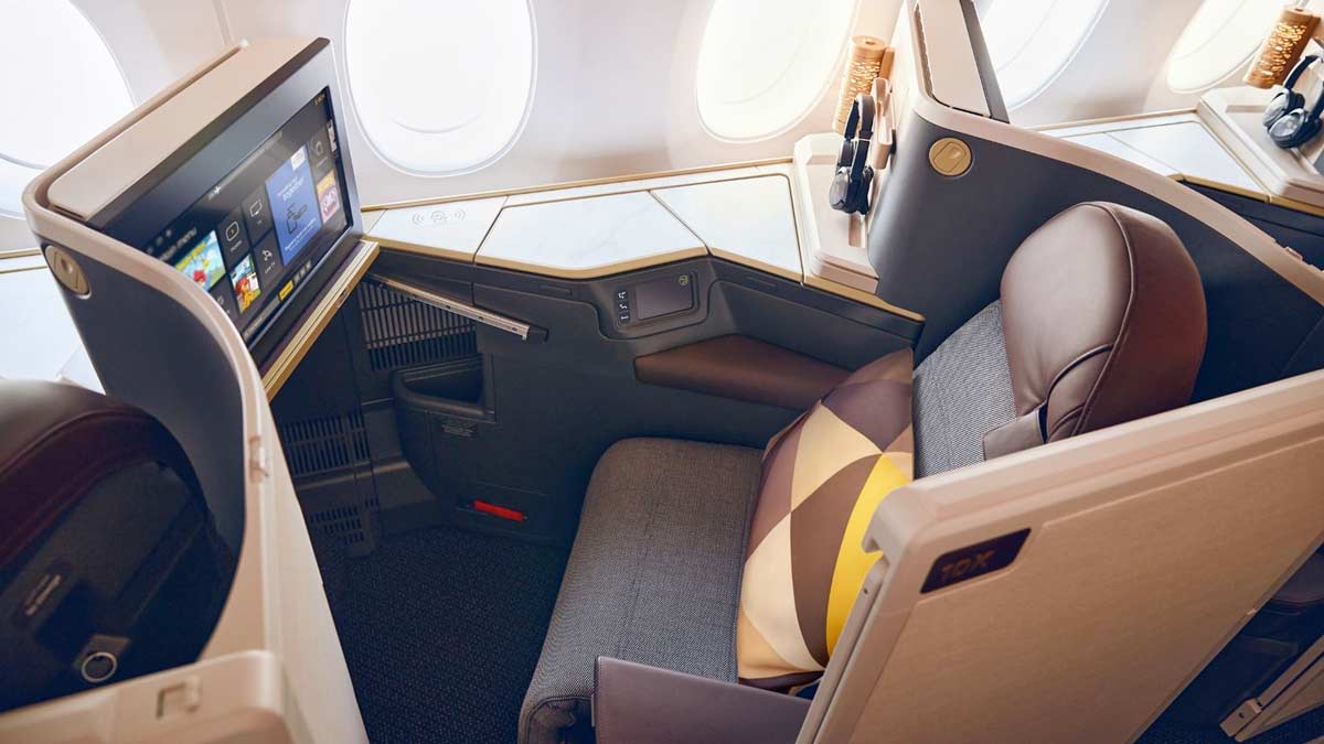 a seat with a tv on the side of it