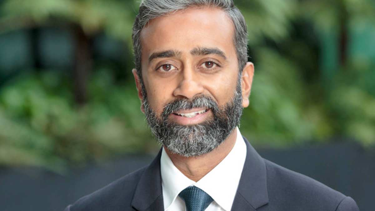 a man with a beard and mustache wearing a suit and tie