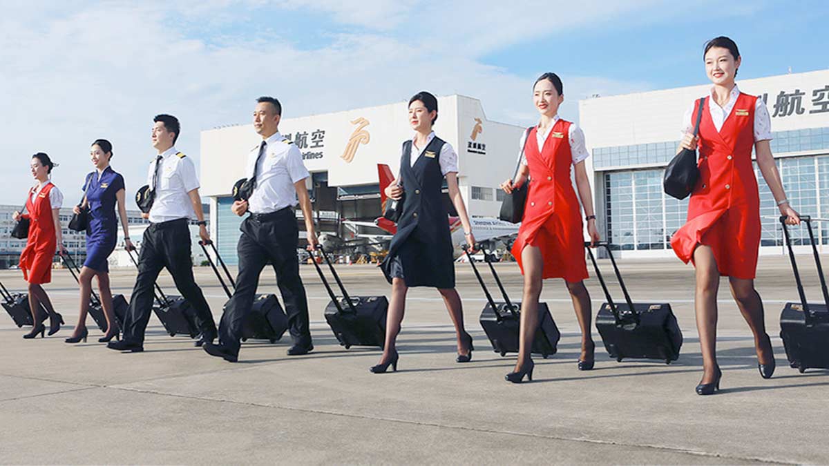 a group of people walking with luggage
