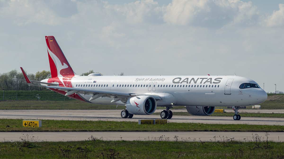a white airplane on a runway