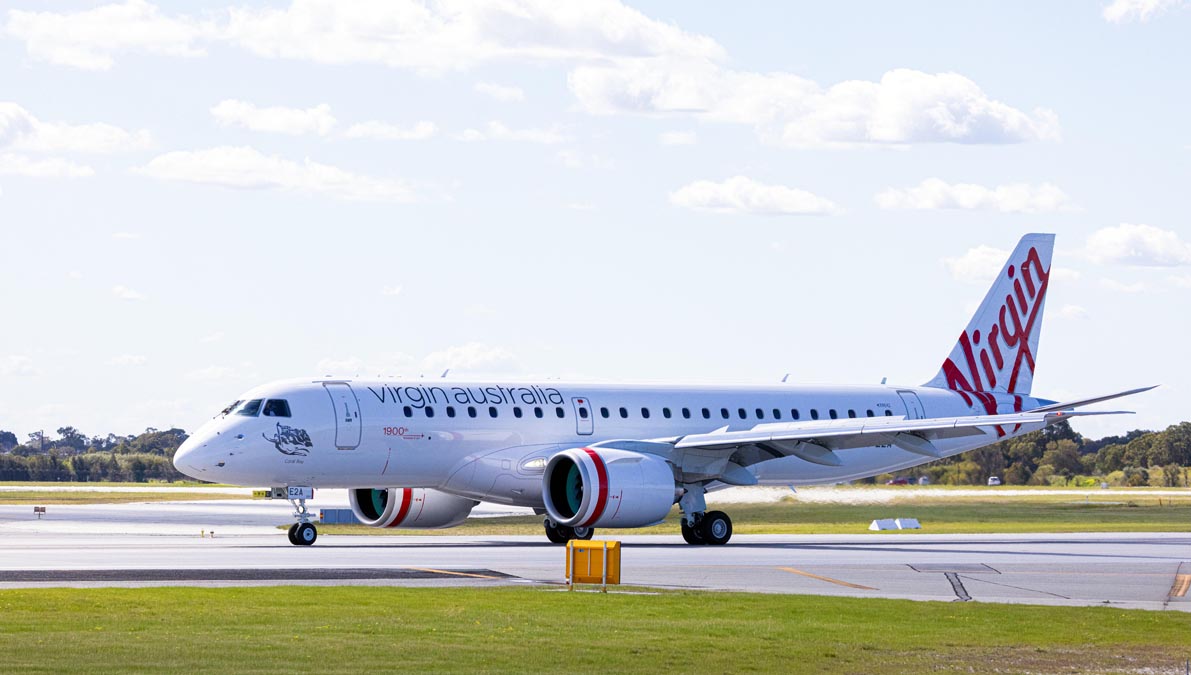 a white airplane on a runway