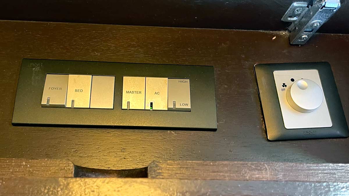 a black rectangular device with silver buttons