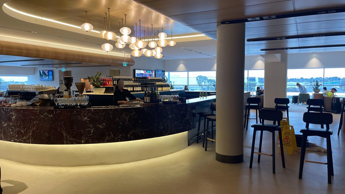 a bar with a counter and a group of people