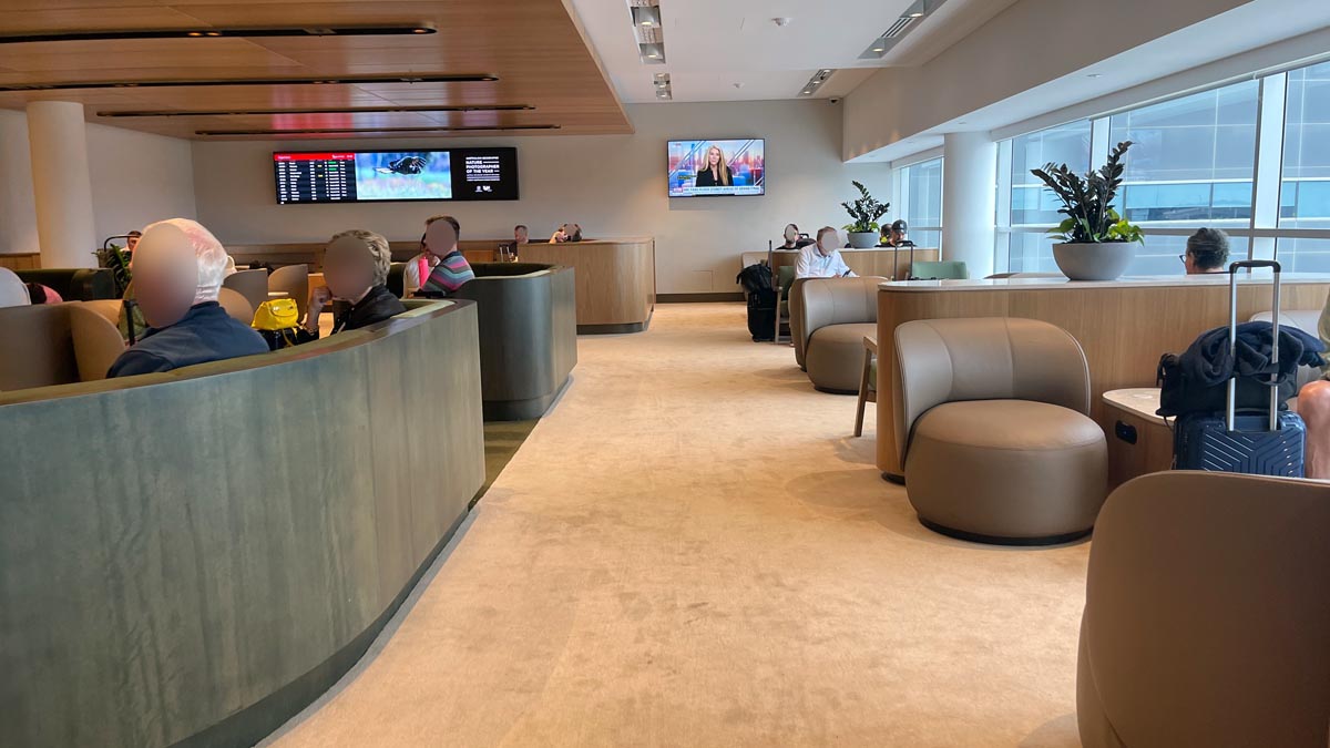 a group of people sitting in a room with chairs