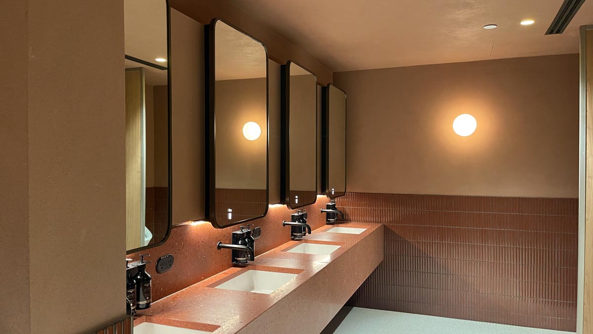 a bathroom with sinks and mirrors