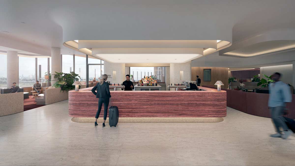 a man and woman standing at a reception desk