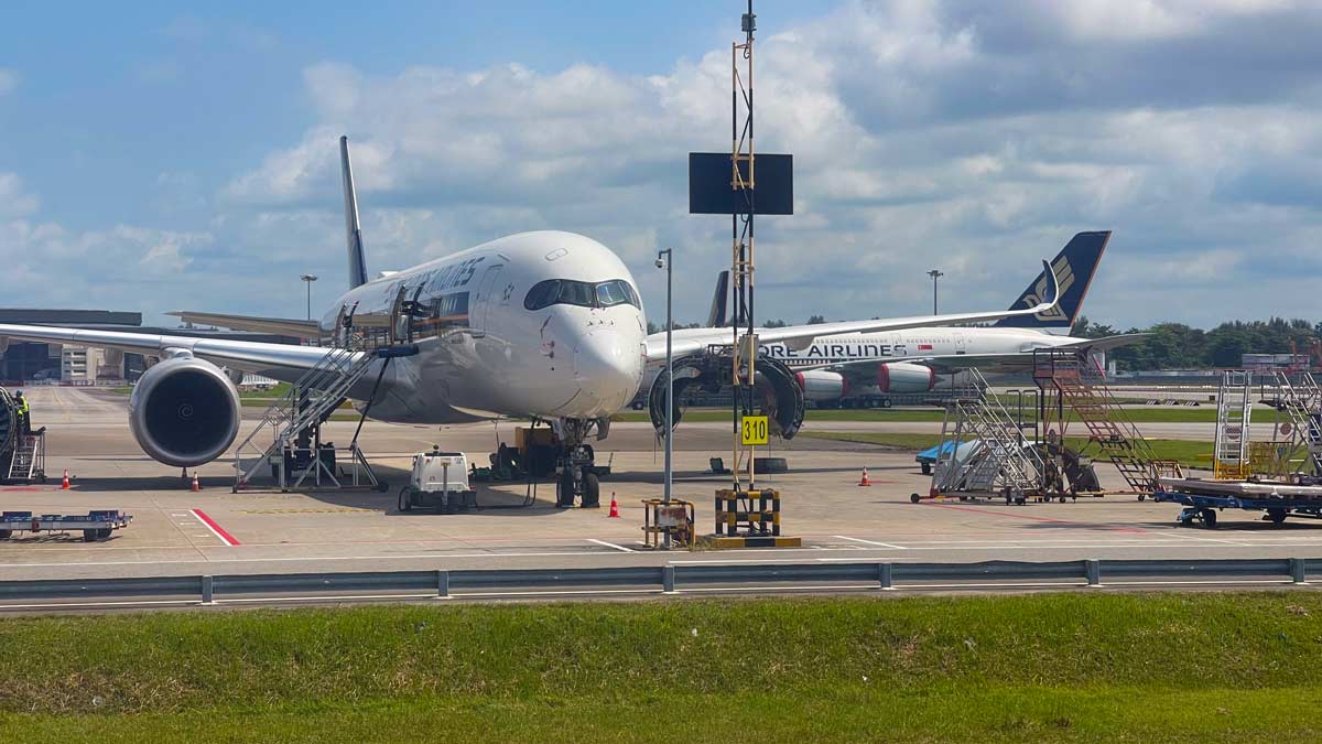a two airplanes on a runway
