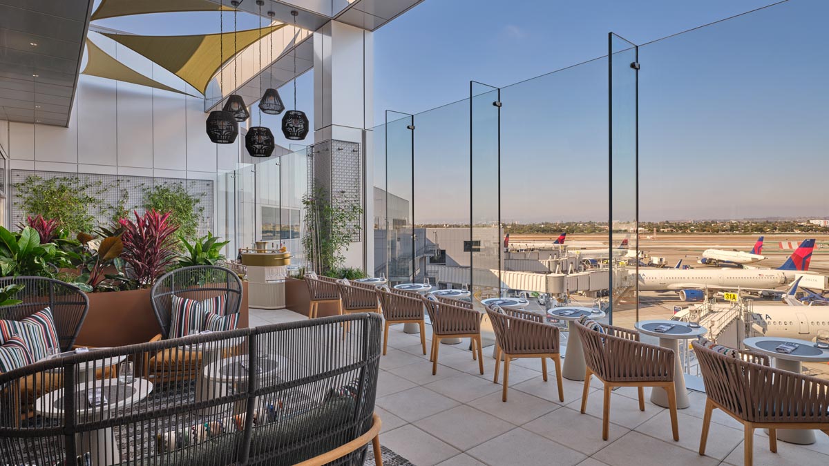 a patio with chairs and tables