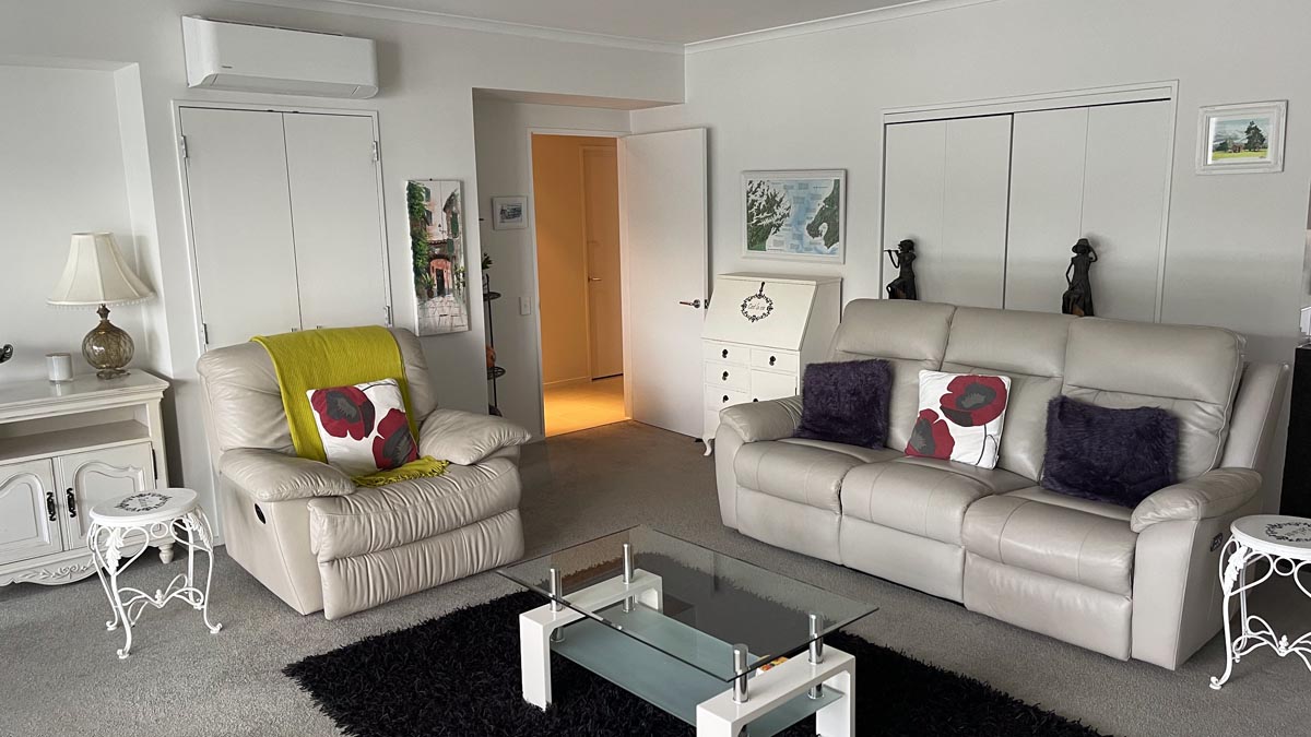 a living room with couches and a coffee table