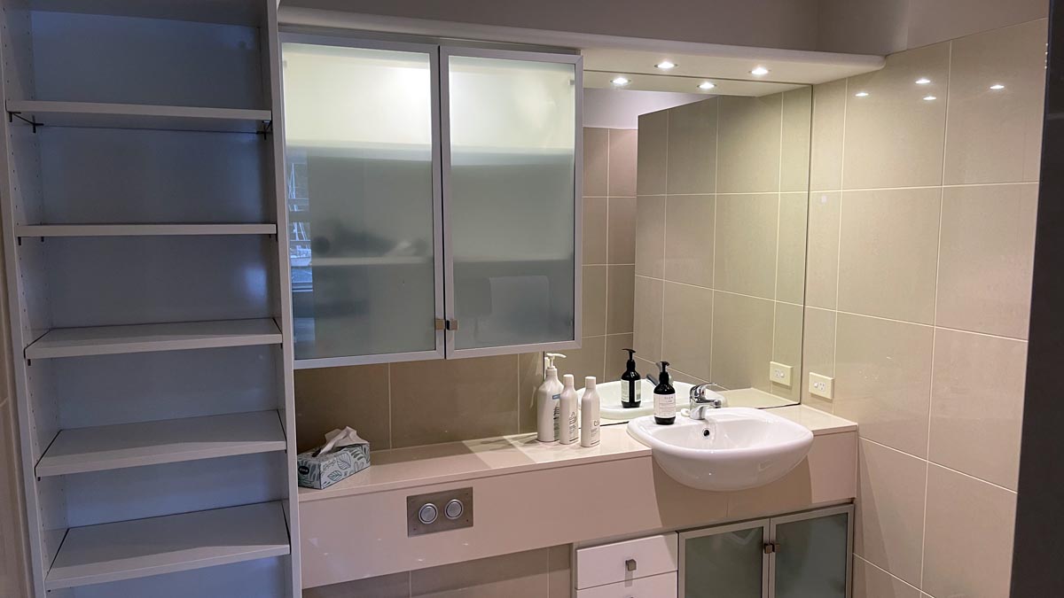 a bathroom with a sink and mirror