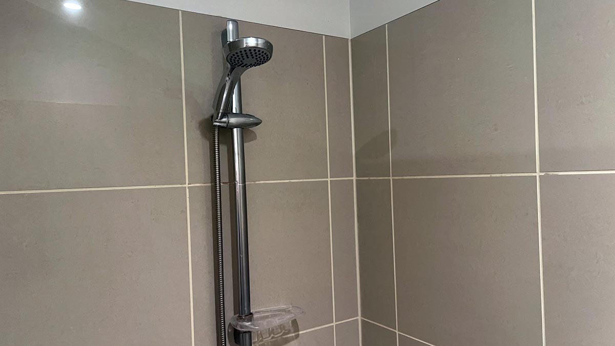 a shower head in a bathroom