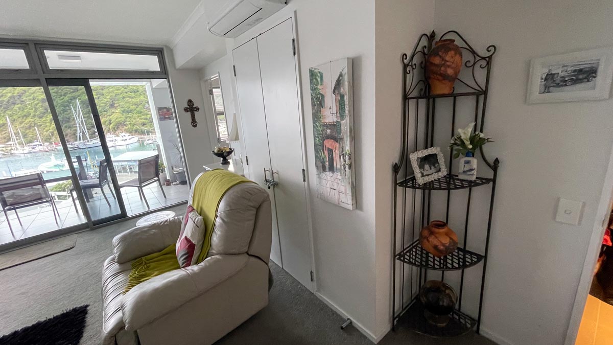 a room with a couch and a shelf