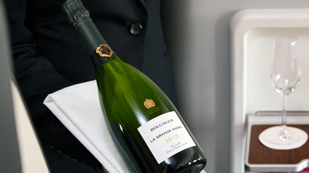 a person holding a bottle of wine