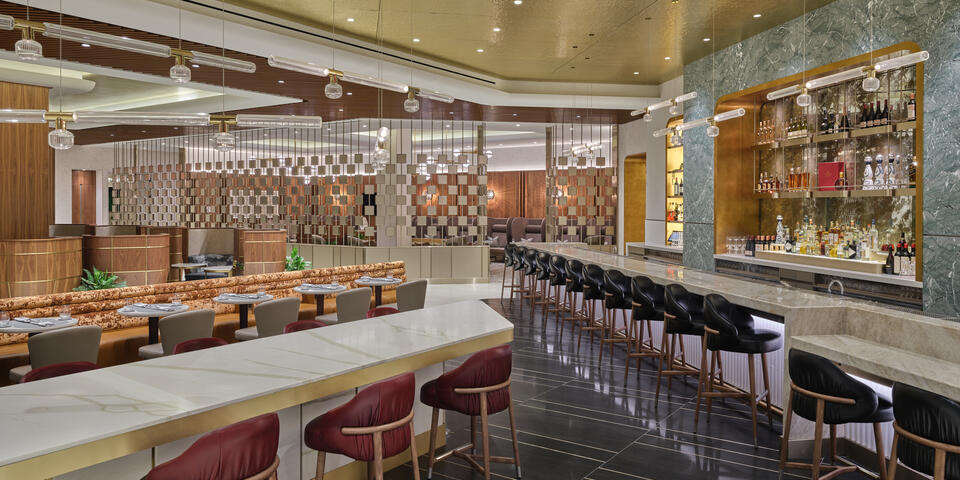 a room with a long table and chairs