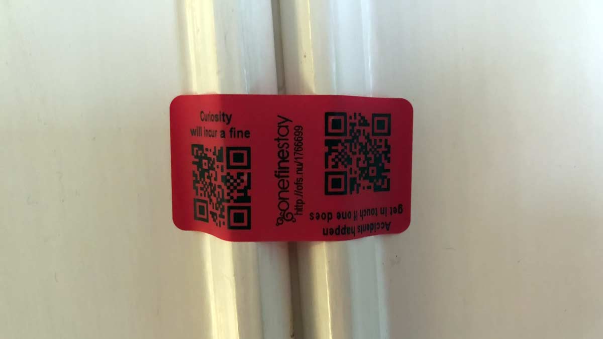 a red tag with black text on it