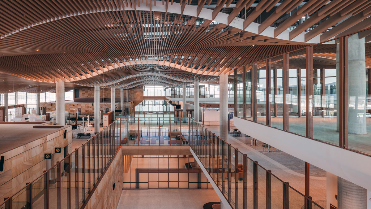 a large building with glass walls and a large ceiling