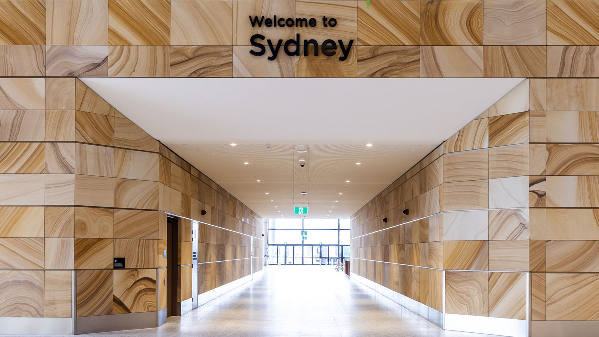 a long hallway with a sign on the wall