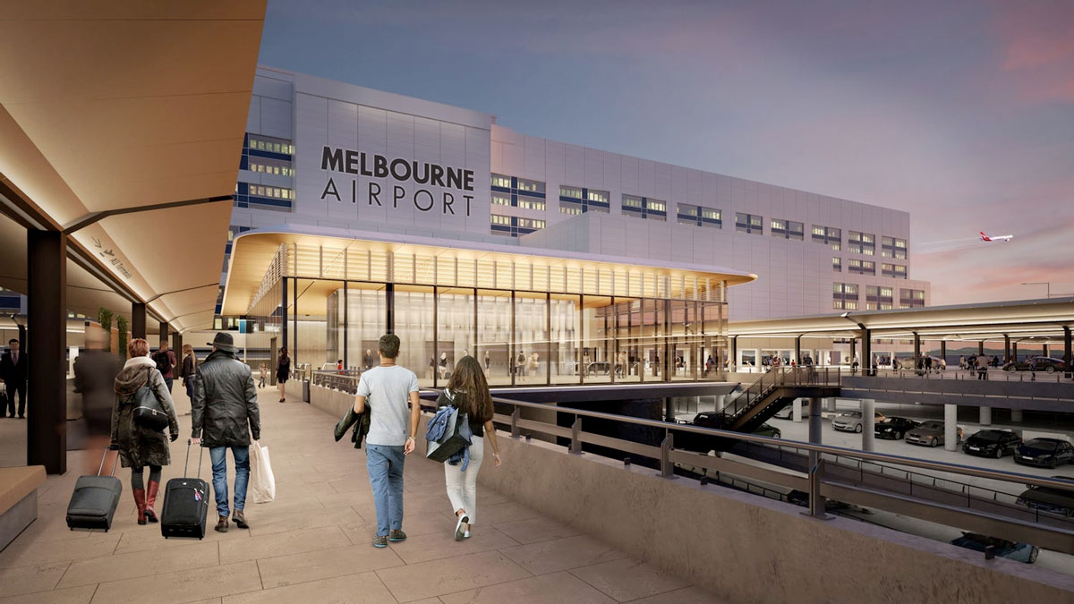 people walking on a sidewalk in front of a building