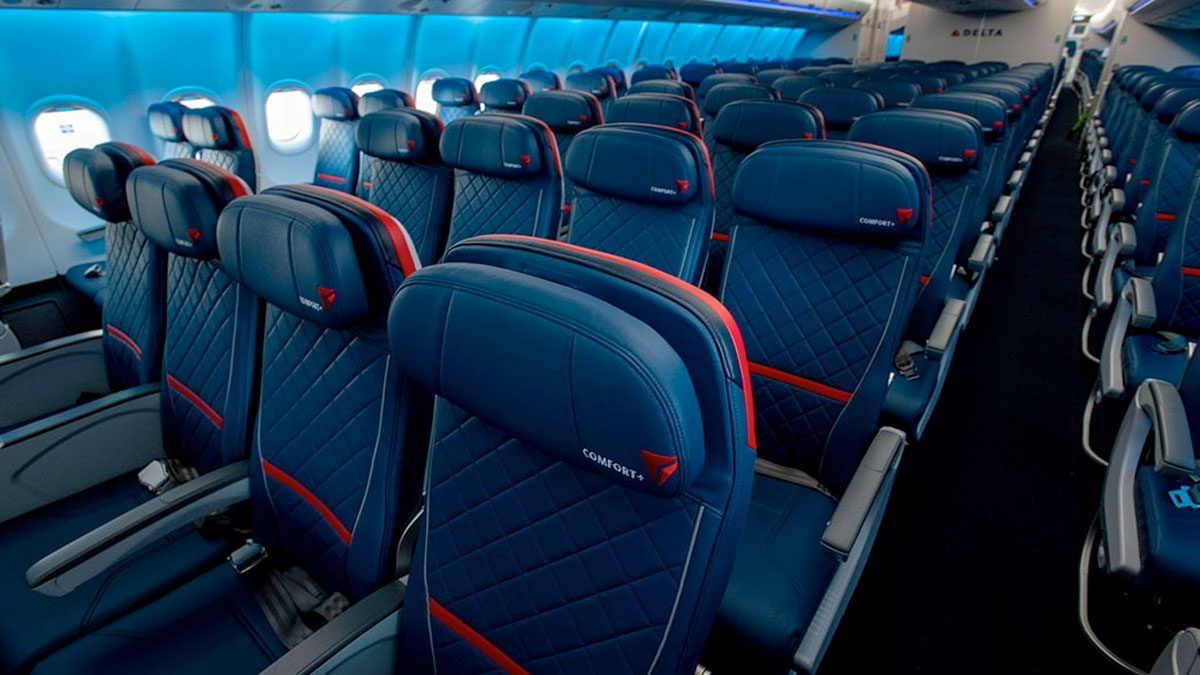 a row of blue seats on an airplane